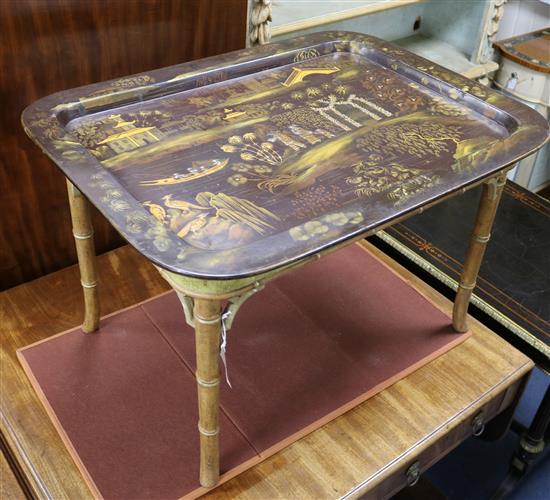 A 19th century papier maché tray on later stand W.77cm